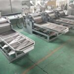 Machine-with-Straight-Cutter-for-Large-Angular-Nut-Particles